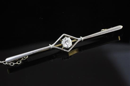 A 20th century gold, platinum and solitaire diamond bar brooch, 2.25in.